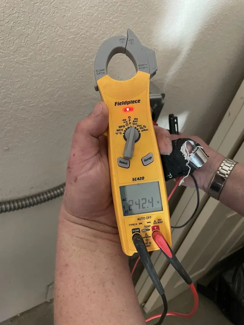 Voltage testing with clamp meter during Generator Installation in Woodstock